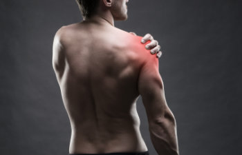 man with pain in shoulder