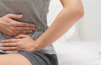 Flatulence ulcer, suffering ache young woman hand holding belly, stomach pain from food poisoning, abdominal digestive problem, gastritis or diarrhea. Abdomen inflammation, menstrual period people.