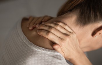 Woman having Shoulder and Neck pain at home. Muscle painful due to pain syndrome and Fibromyalgia, rheumatism, Cervical Spine